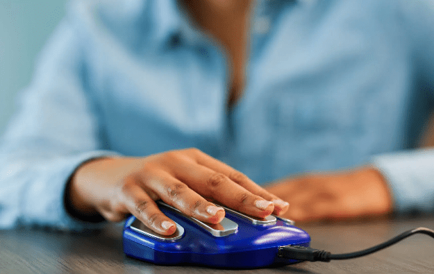 woman has hand on Zyto hand cradle